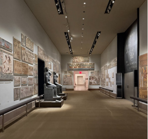 Various Egyptian artifacts in an exhibit at the Met.