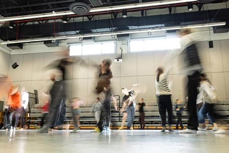 blurred photo of dancers in large room