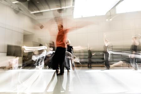 blurred image of dancer in red top