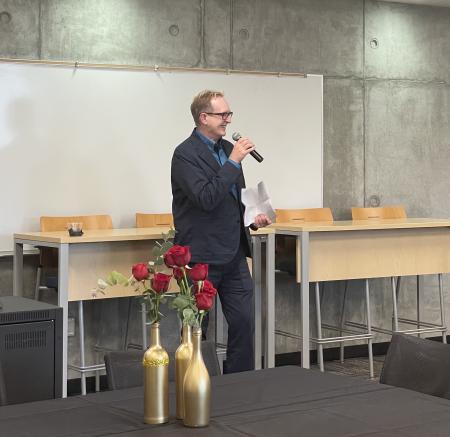 Dean Miller giving a speech at his reappointment party.