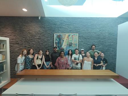 Group stands with artist.