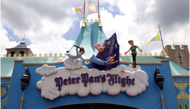 Disney opening its gates 70 years ago with Peter Pan's Flight the ride in center focus.