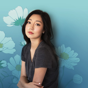 E.J. Koh with a floral, blue background