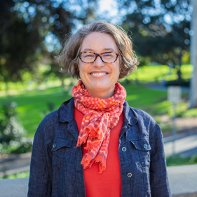 Margherita Long smiling with a park in the background 