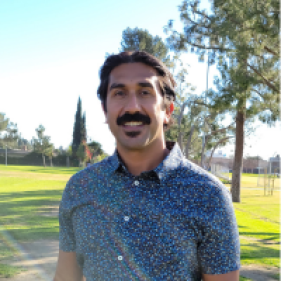 Muhammad Rafi smiling in a park