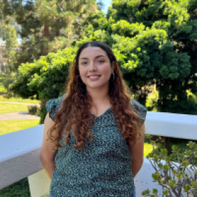 Viviana Alvarez Rodriguez smiling in front of trees