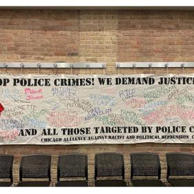 Building with Banner "STOP POLICE CRIMES! WE DEMAND JUSTICE..."