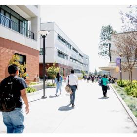 Image of people walking on a campus