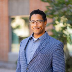 A photo of Assistant Dean, Tomas Figueroa, smiling.