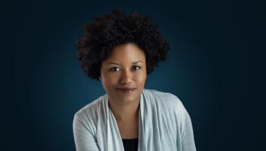 A headshot of Bridget Cooks against a navy blue background