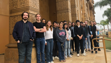 Jain studies students standing in front of a building at the Jain Center of Southern California.