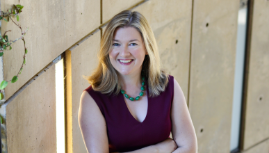 Bernadette Meyler headshot. She is standing with her arms crossed.