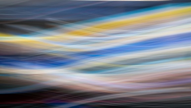 blue and yellow light trails crisscrossing