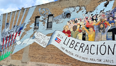 Mural painted on Division Street in the historic Paseo Boricua neighborhood of Humboldt Park, Chicago that reads "Oscar, somos la marejada de la liberación" ("Oscar, We Are the Groundswell of Liberation")