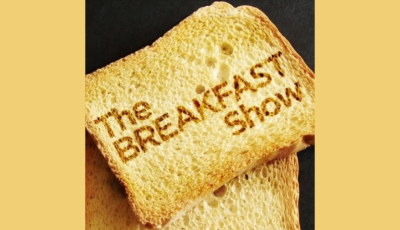 Piece of toast with The Breakfast Show branded onto it.